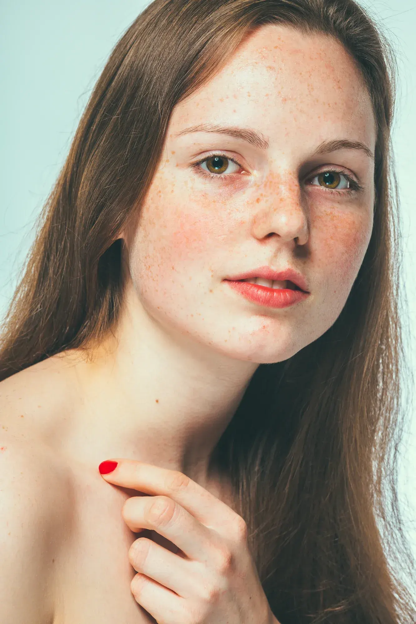 Patient evaluating tired, dull complexion at Radiant Laser MD Cambridge
